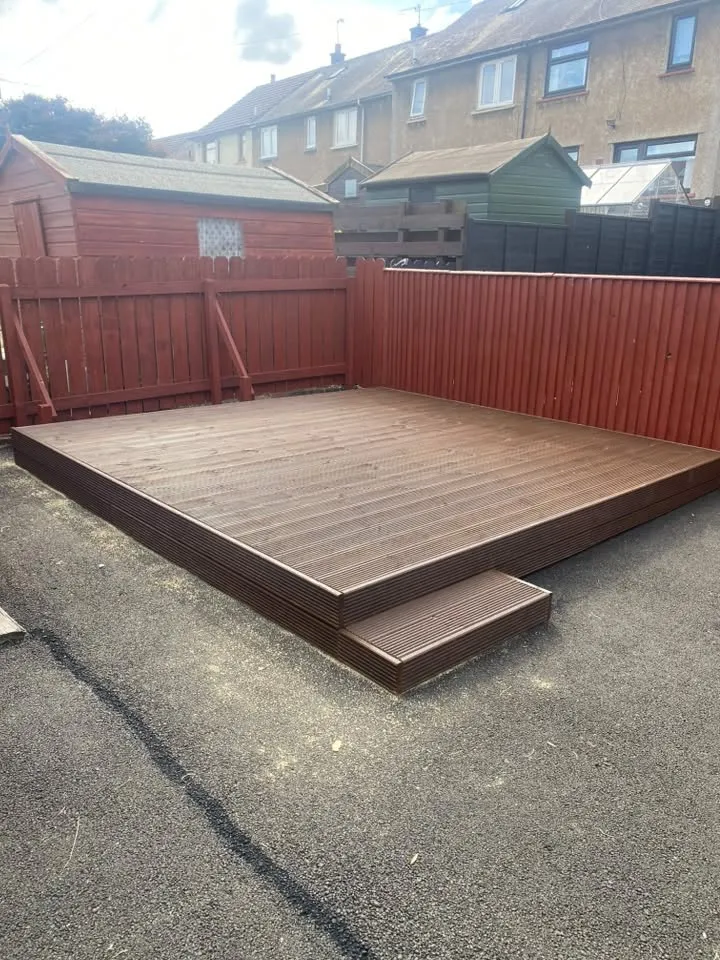 Dark-brown timber decking platform with step